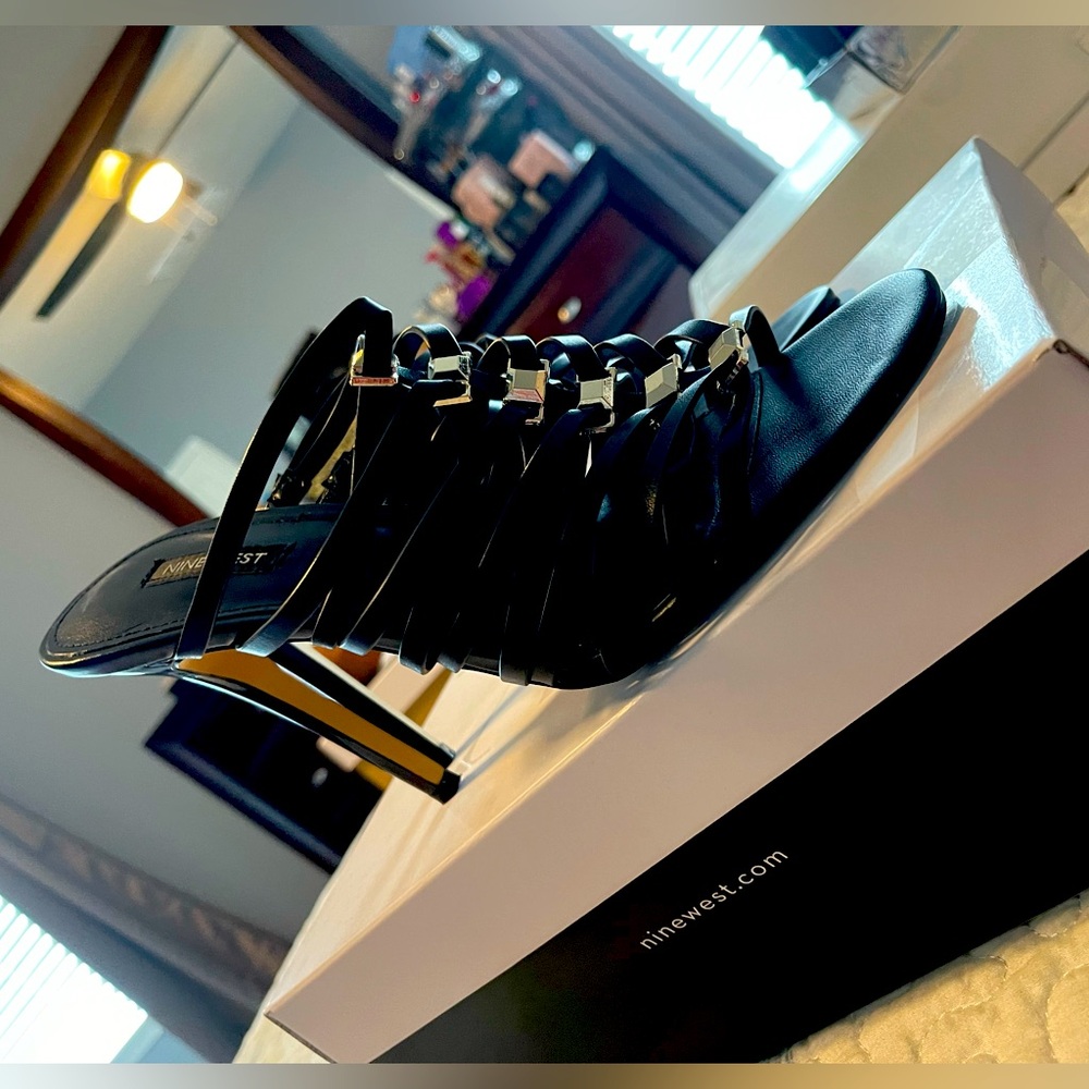 Back and silver SZ Nine West stiletto mules.